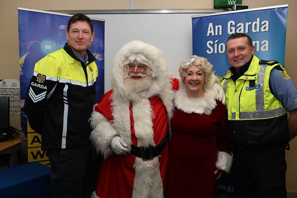 Sgt John Dunne and Garda Brian Caroll with Santa and Mrs Claus Sgt John Dunne and Garda Brian Caroll with Santa and Mrs Claus